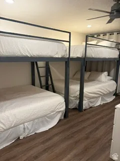 Bedroom featuring two metal bunk beds, recessed lighting, wood-finish flooring, and a ceiling fan