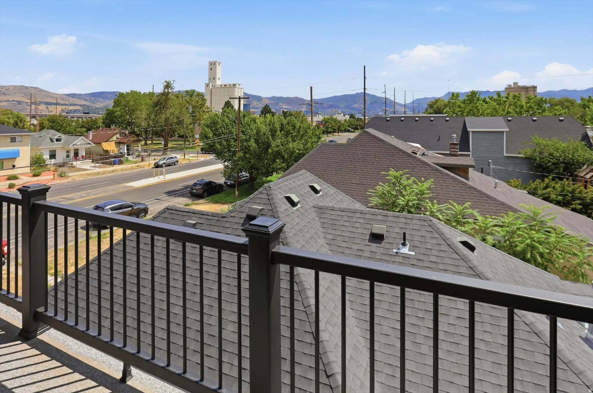 Outdoor balcony featuring a dark gray baluster railing