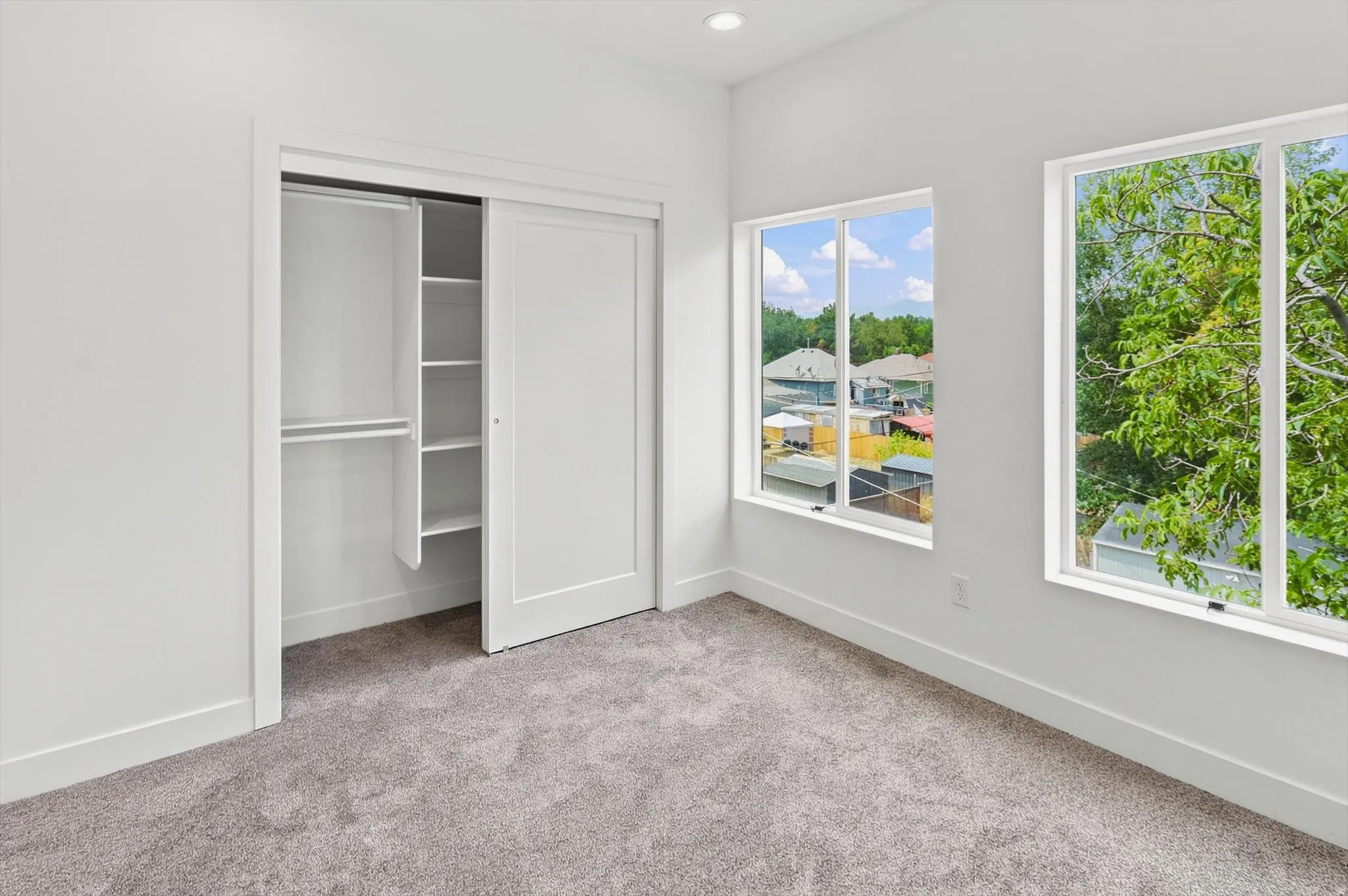 Neutral-toned carpeting complementing white walls