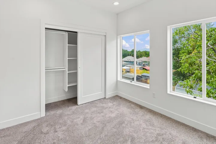 Neutral-toned carpeting complementing white walls