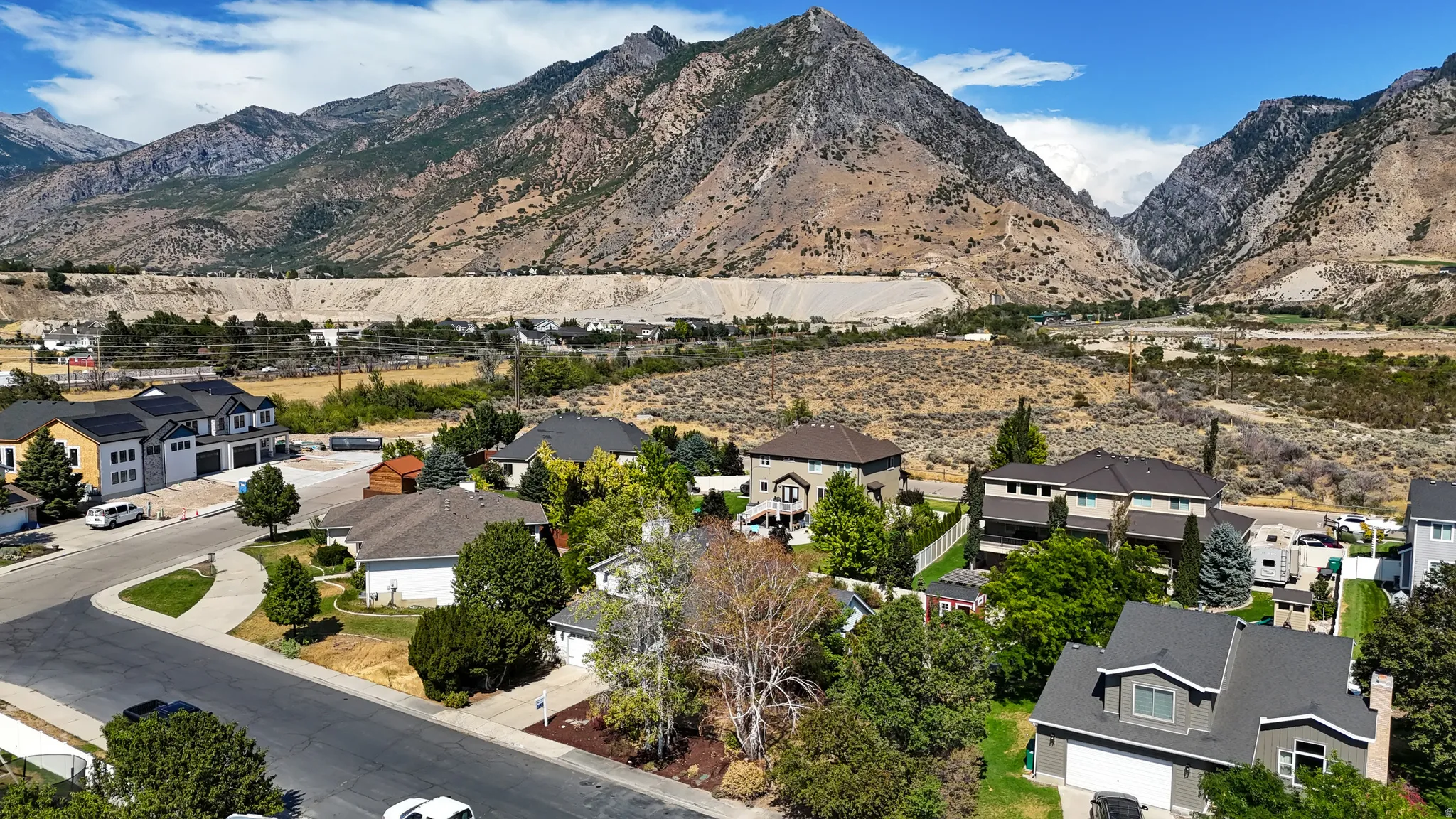 Residential neighborhood nestled against a mountainous backdrop