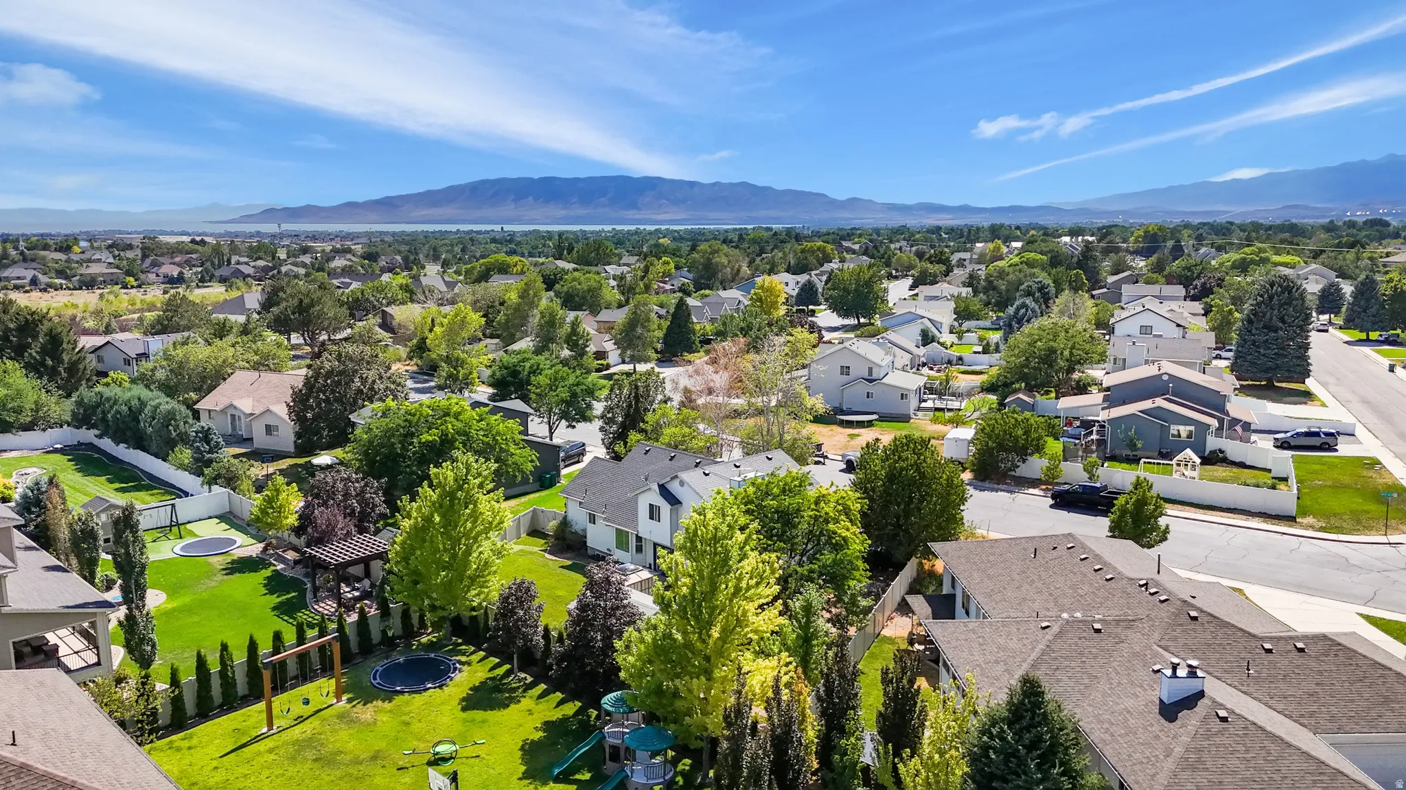 Expansive neighborhood with diverse residential architecture and mature landscaping