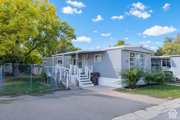 Gray exterior siding with white trim