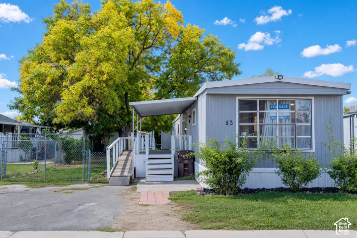 Light gray siding exterior with a covered porch