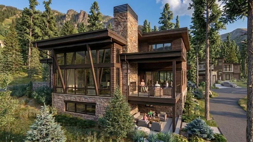 Modern mountain architecture featuring extensive stone and wood siding