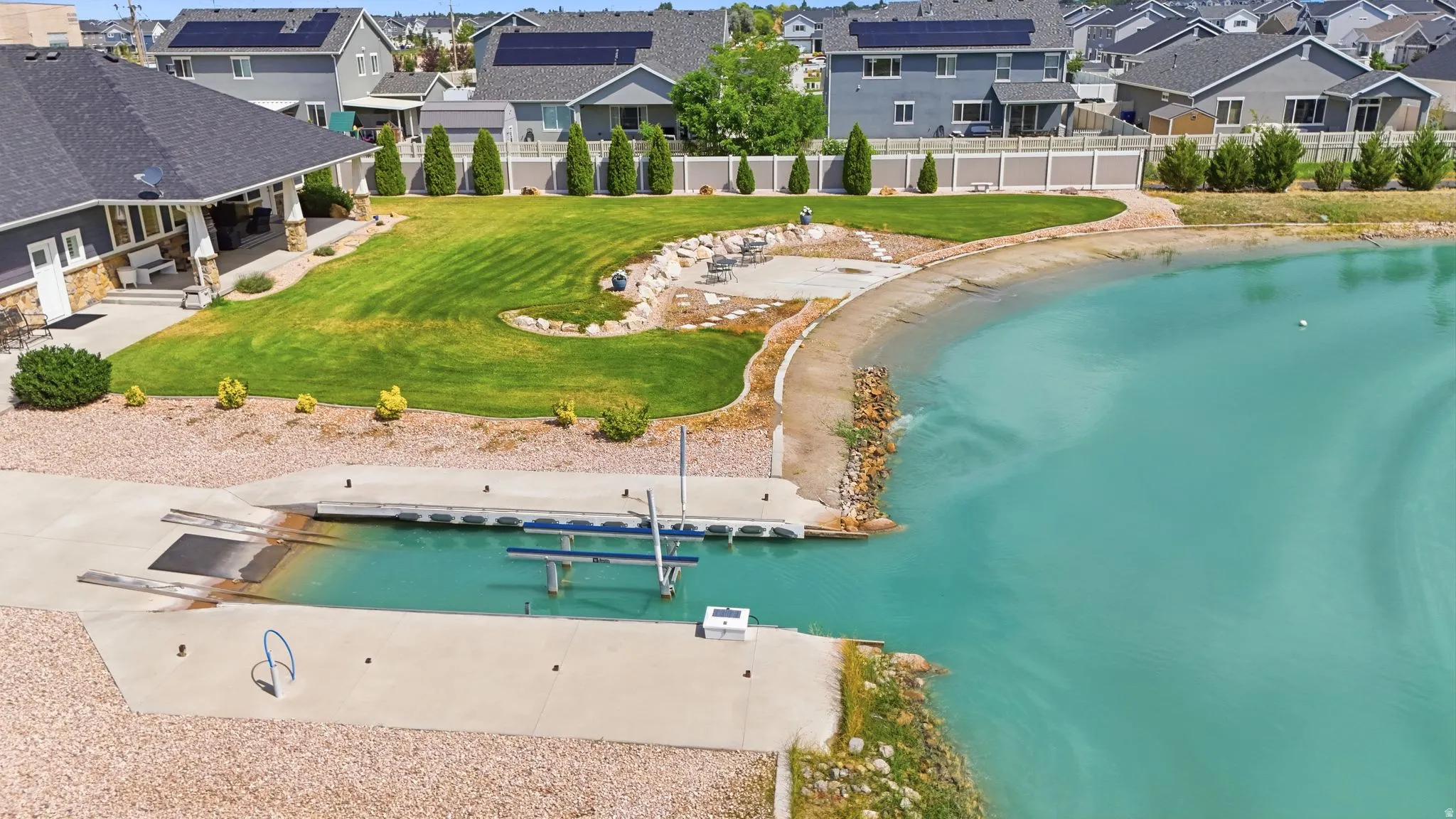 Private boat launch, private dock, private sandy beach cove and a manicured lawn