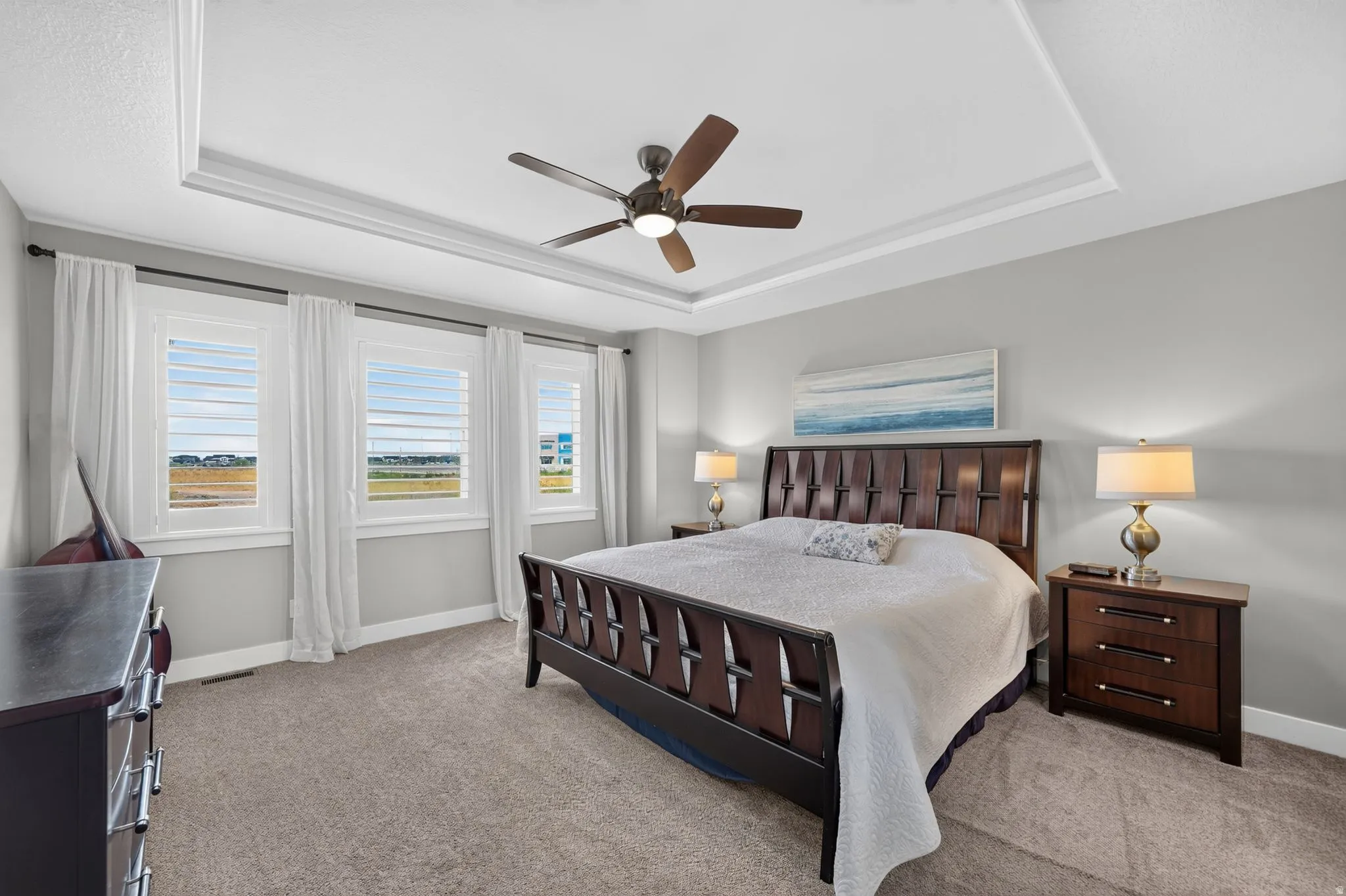 Primary bedroom with ceiling featuring a contemporary ceiling fan