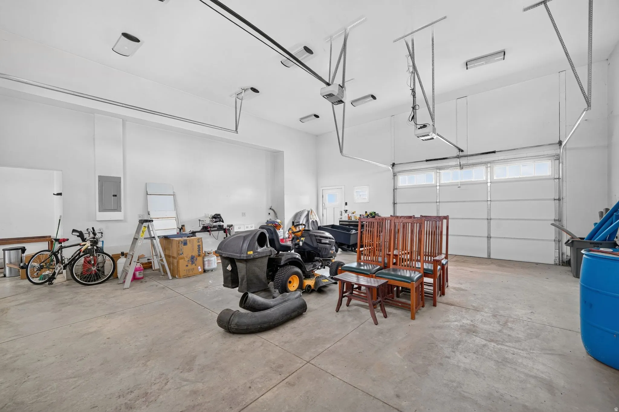 Spacious garage with large garage doors opening directly to boat ramp and front driveway