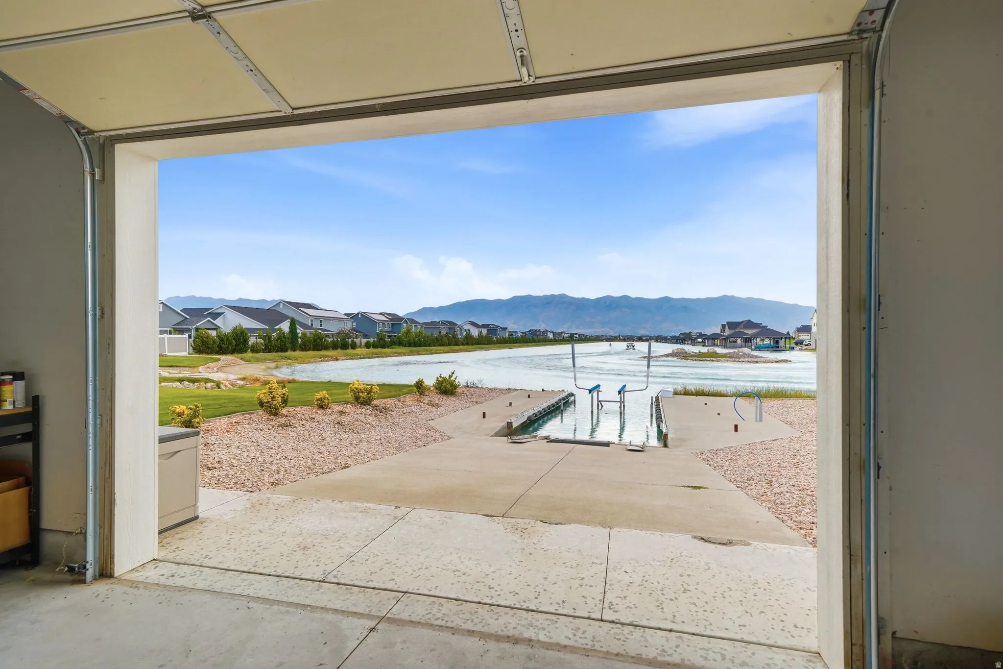 Waterfront ramp with direct access from garage onto boat lift