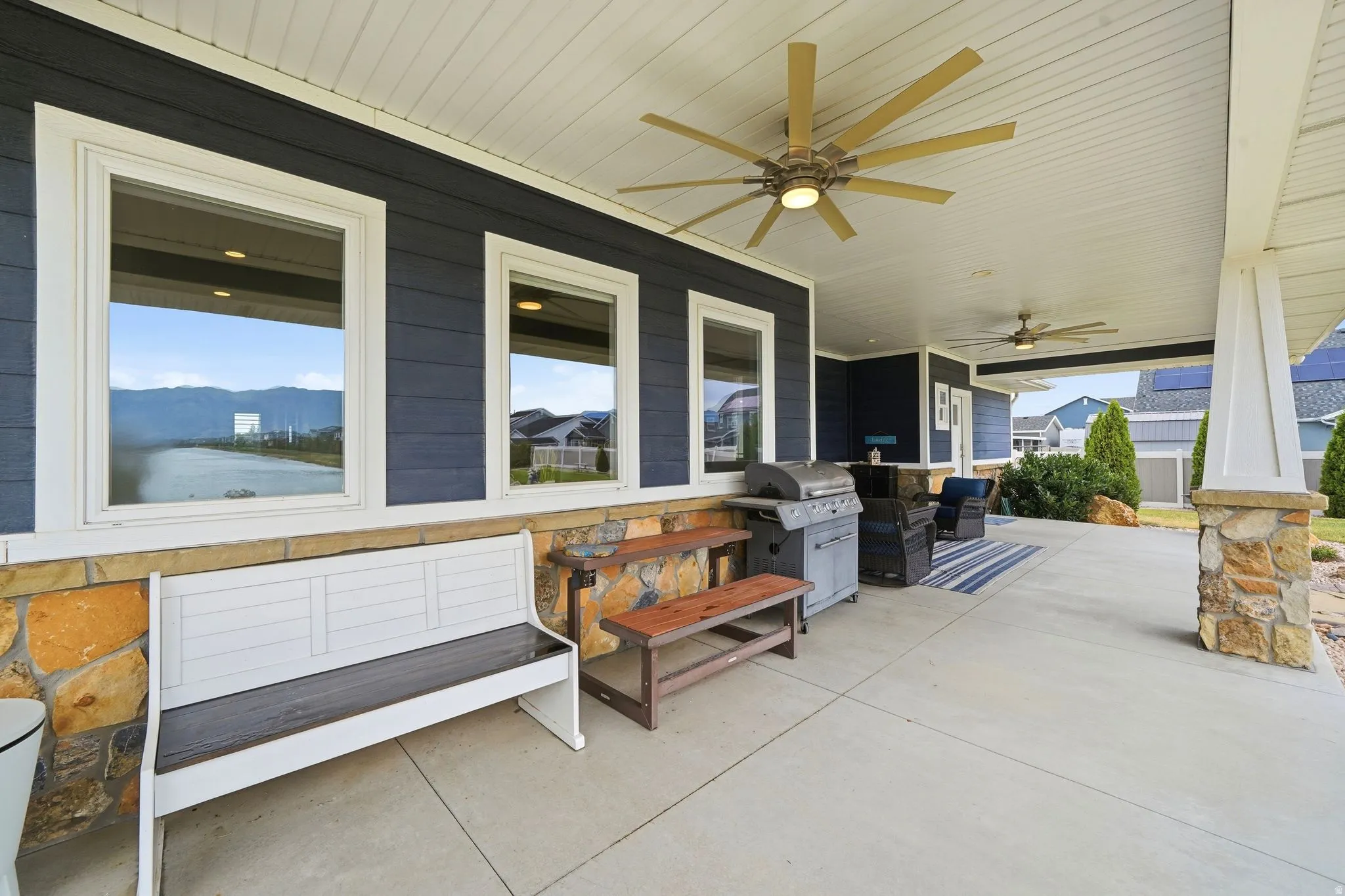 Spacious covered patio featuring patio furniture, kitchen and primary bedroom access