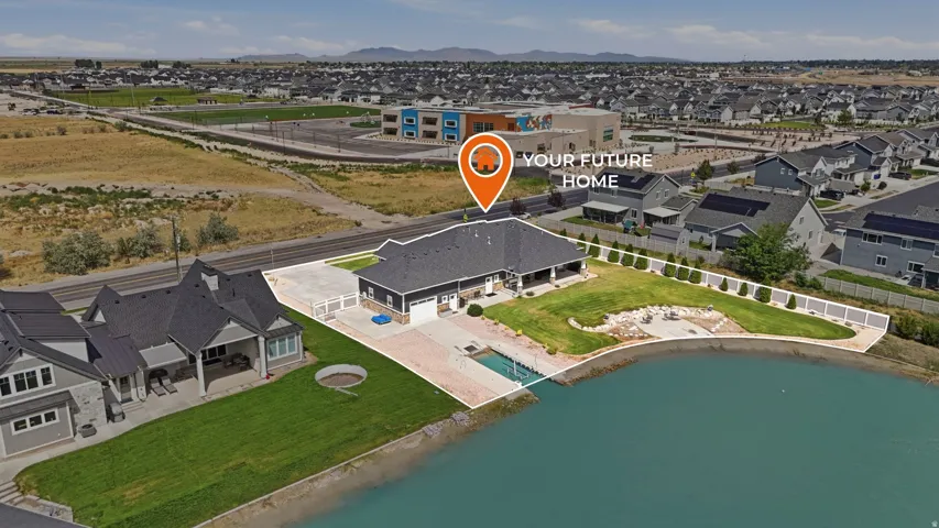 Waterfront property featuring a landscaped lawn, a private dock, and a patio area