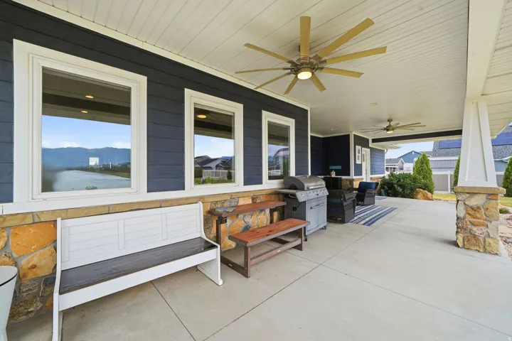 Spacious covered patio featuring patio furniture, kitchen and primary bedroom access