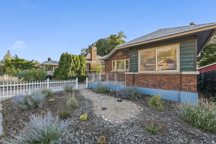 Brick and siding exterior with a pitched roofline