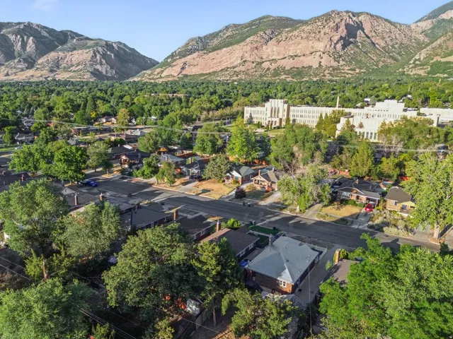 Aerial perspective featuring a residential area with mature trees and paved streets