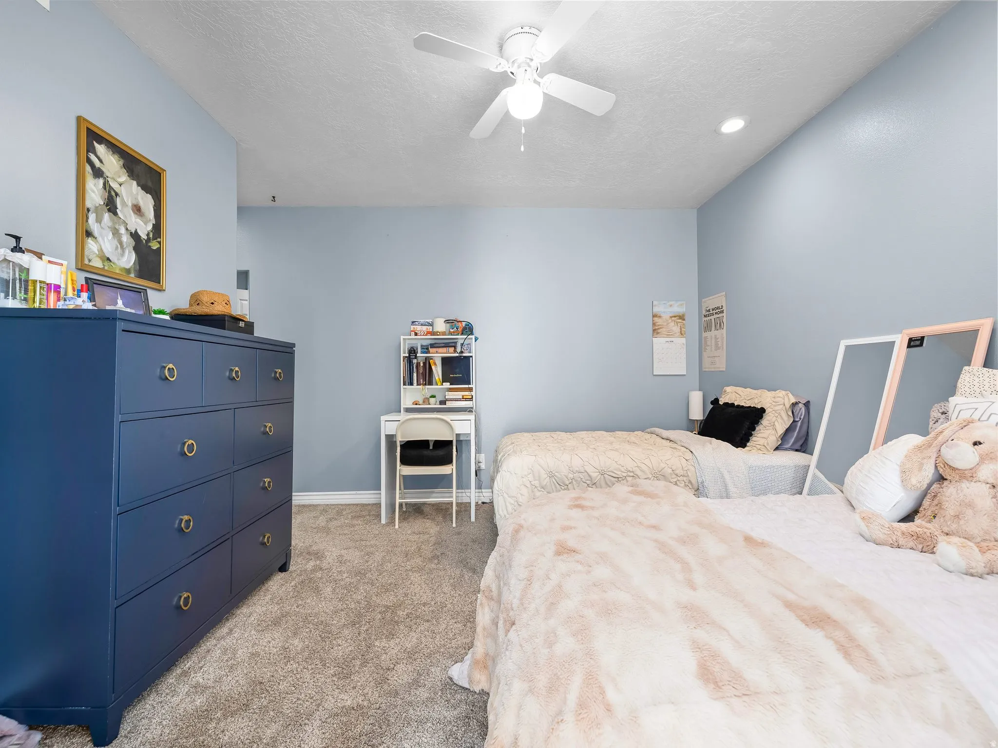Carpeted bedroom featuring a vaulted ceiling with a ceiling fan, recessed lighting, and light blue walls