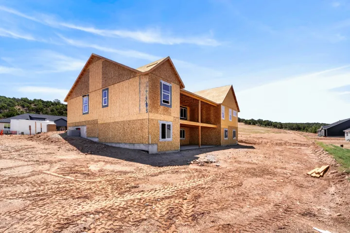 New construction framing featuring a two-story design and gabled rooflines