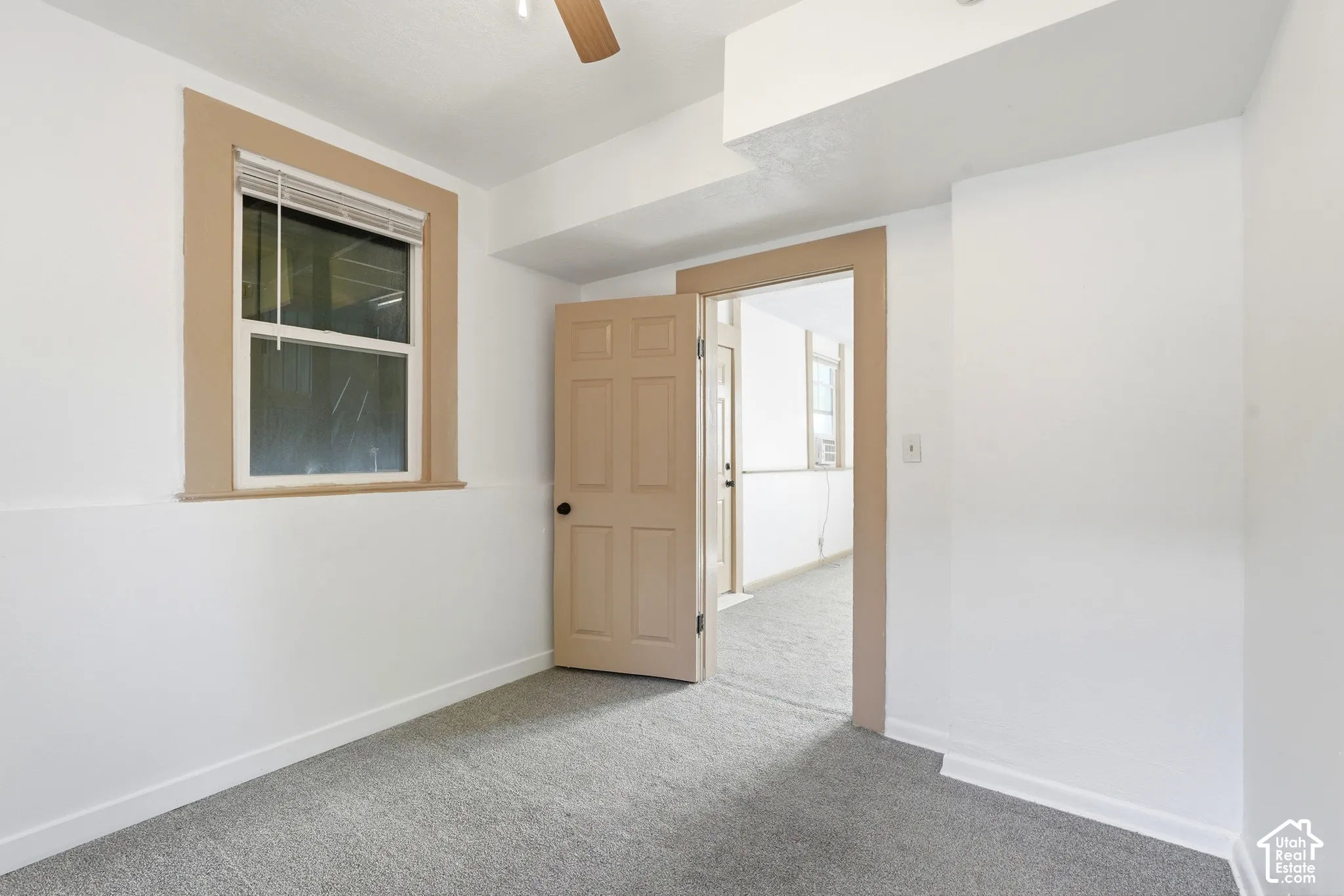 Room featuring neutral gray carpeting and white walls