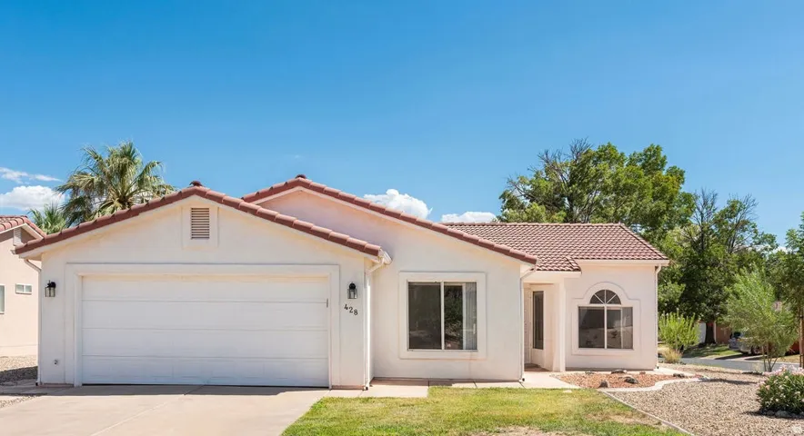 Single-story stucco exterior with a terra cotta tile roof, Exterior Front