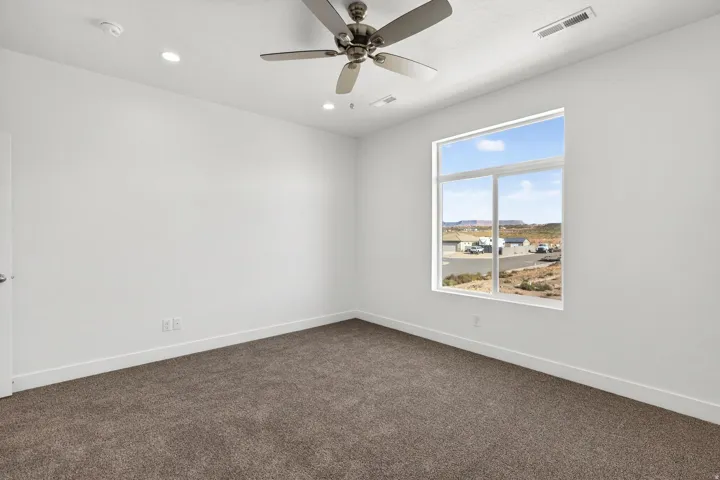 Neutral-toned carpet flooring complementing white walls