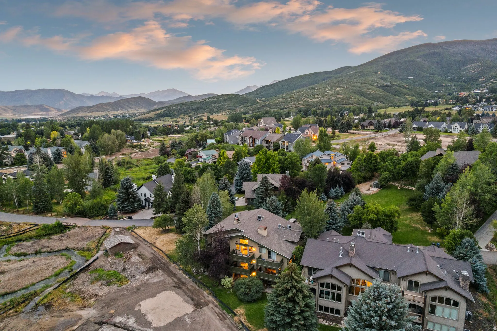 Expansive aerial showcasing a mountainous landscape with mature trees