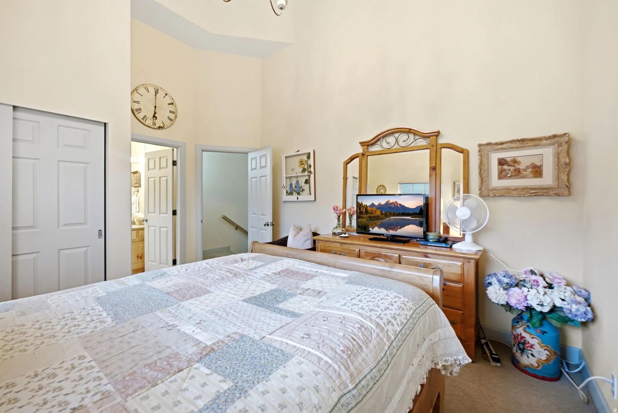 Bedroom featuring vaulted ceilings and neutral wall paint