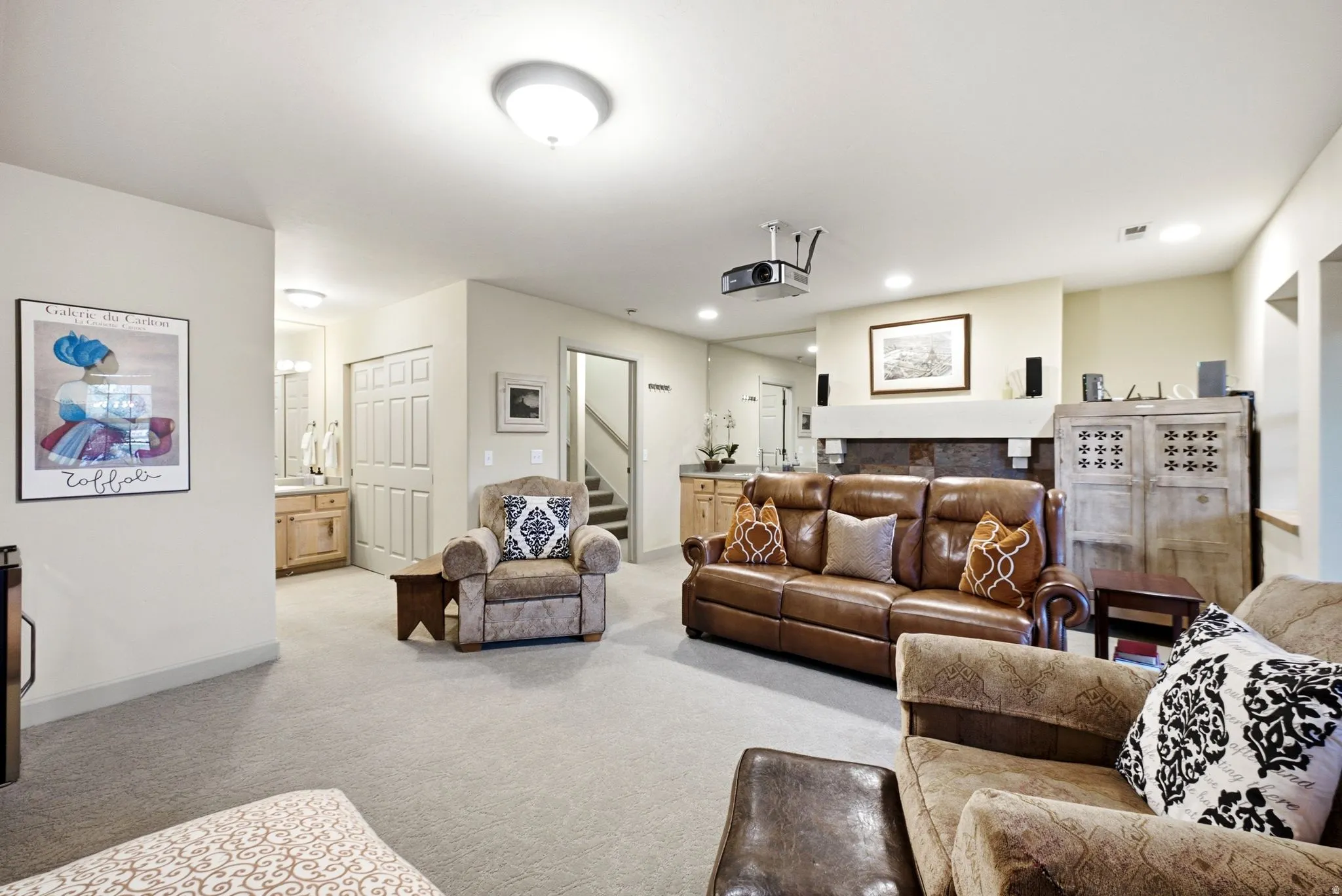 Spacious lower-level area featuring light-toned carpeting and neutral wall colors