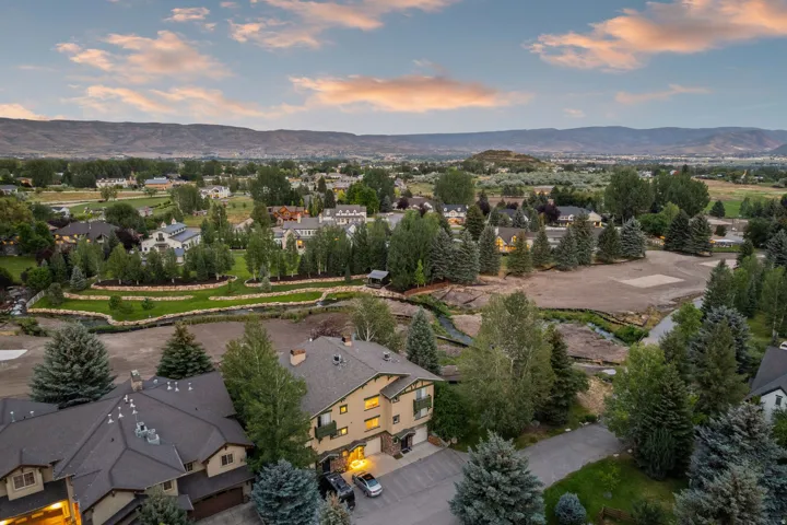 Expansive residential setting featuring varied architectural styles and mature landscaping