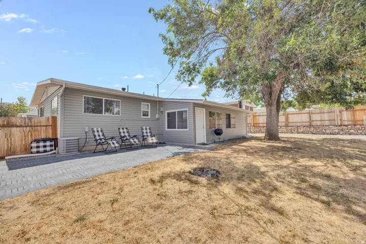 Rear exterior featuring light grey horizontal siding