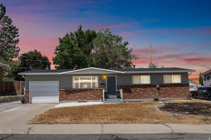 Ranch-style residence featuring a brick and siding exterior, a concrete driveway, and an attached single-car garage