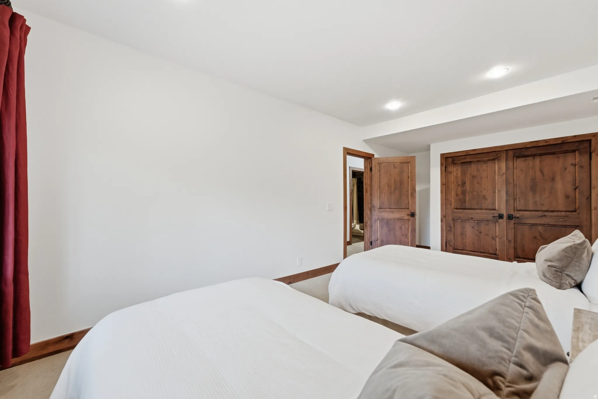 Room featuring light-colored walls and recessed lighting