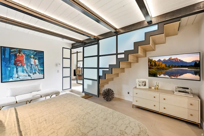 Architectural open-riser staircase with wood treads and metal stringers