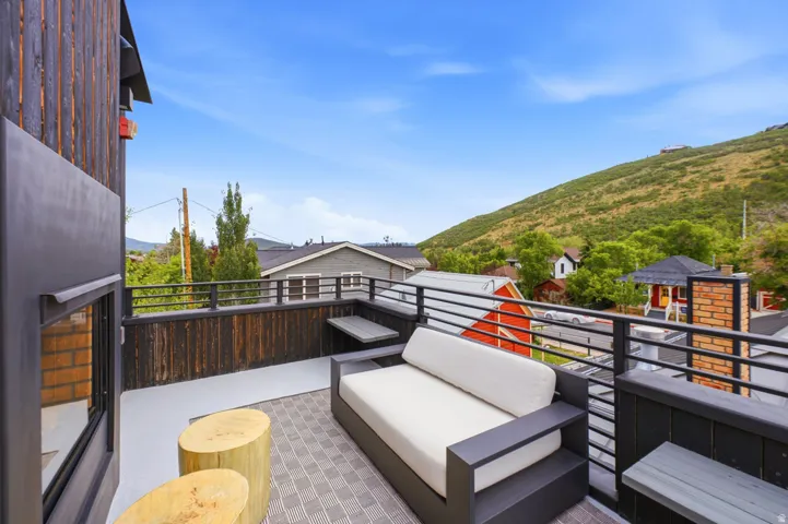 Expansive outdoor deck featuring composite decking and a black metal railing