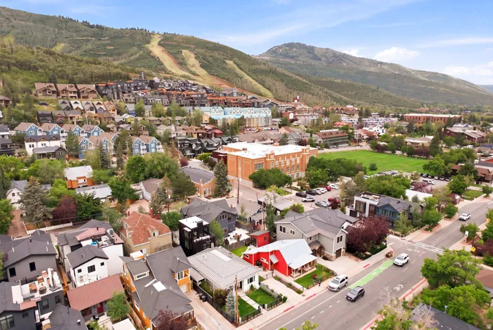 Residential community featuring a variety of architectural styles, surrounded by natural mountainous terrain