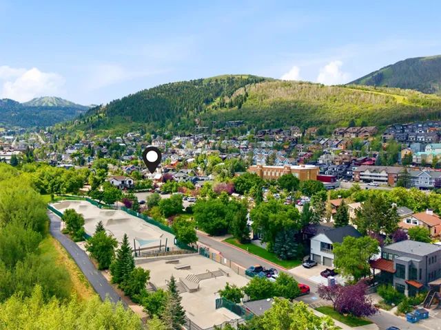 Aerial overview showcasing a mountainous landscape and a residential area
