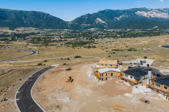 Newly paved road with mountain backdrop