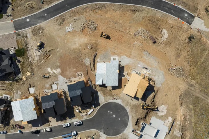 Aerial view of a developing residential area with multiple properties under construction