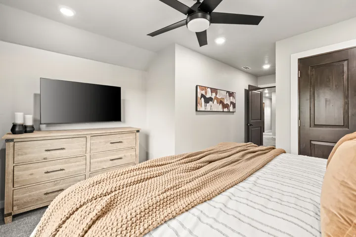 Interior room featuring light gray walls and dark wood-finish doors