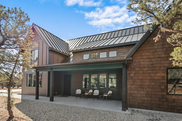 Modern exterior featuring shingle siding and board-and-batten accents