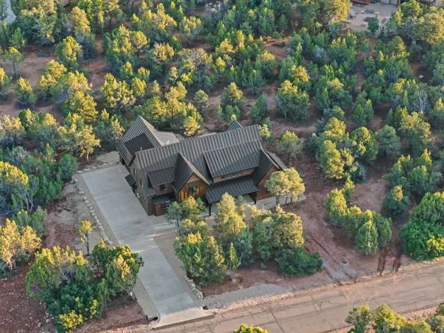 Custom-built residence featuring multiple gables and a dark metal roof