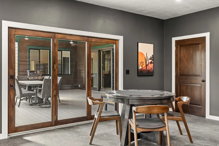 Game room with poker table and door to the back deck
