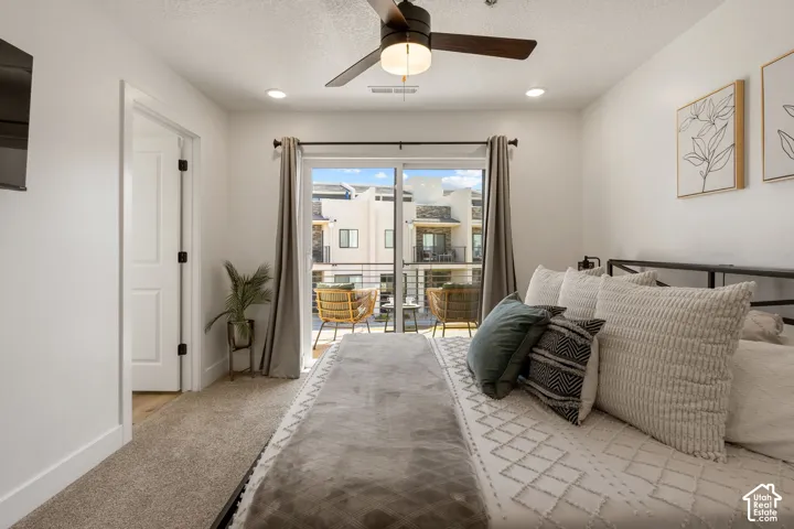 Bedroom featuring a ceiling fan with integrated lighting, recessed lighting, and direct access to an outdoor balcony
