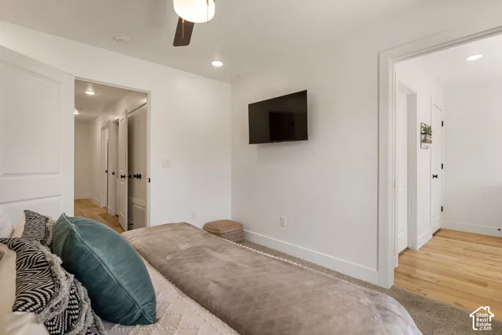 Interior room featuring white walls, a ceiling fan with integrated lighting, and recessed lighting