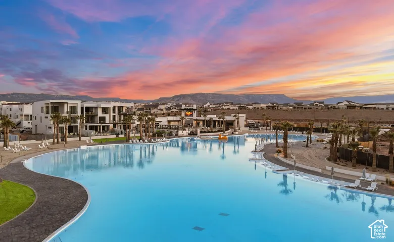 Expansive lagoon-style pool bordered by modern resort-style residences