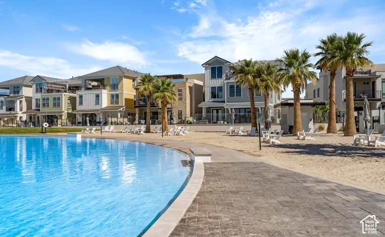 Expansive artificial lagoon with a surrounding sandy beach area