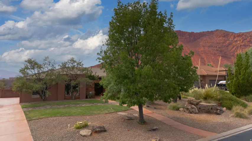 Southwestern architectural style with a stucco exterior and a tile roof