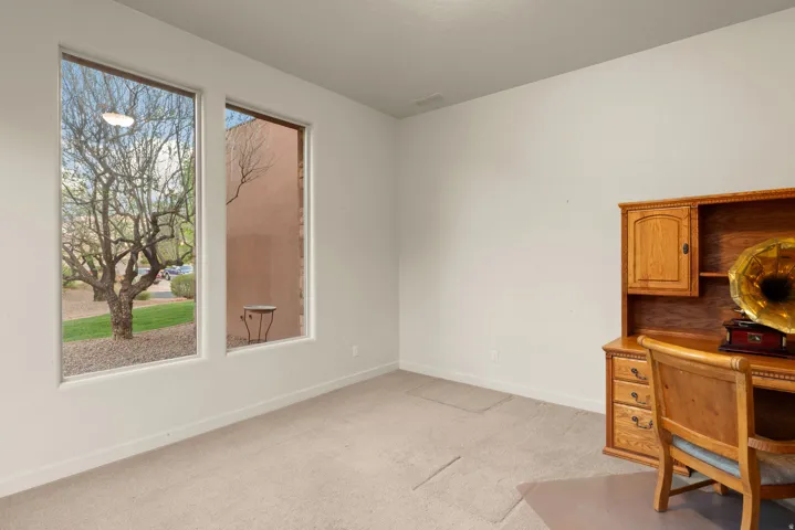 Light-toned wall finishes and carpeting