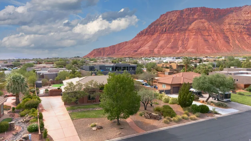 Sprawling residential area with distinctive red rock mountain backdrop