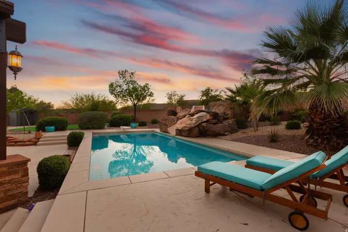 In-ground swimming pool with stamped concrete decking