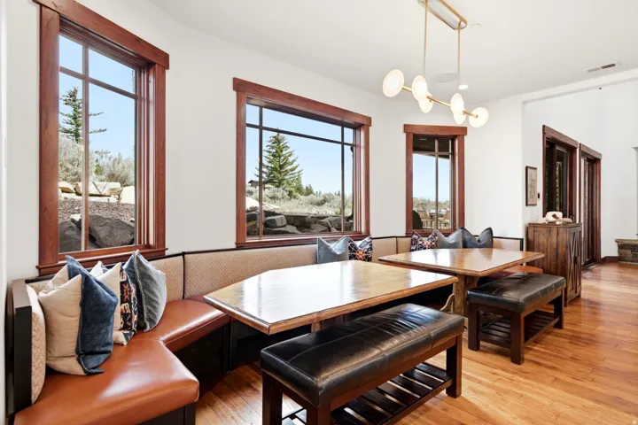 Built-in banquette seating with brown leather upholstery and textured backrests