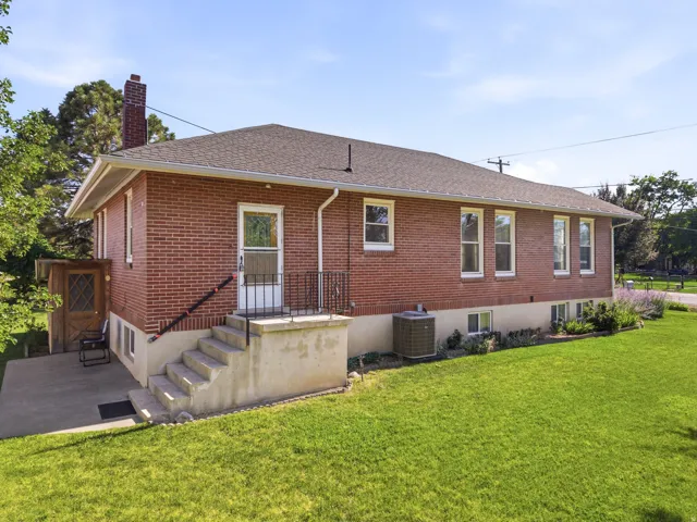 Brick exterior with a gabled roof and white trim windows